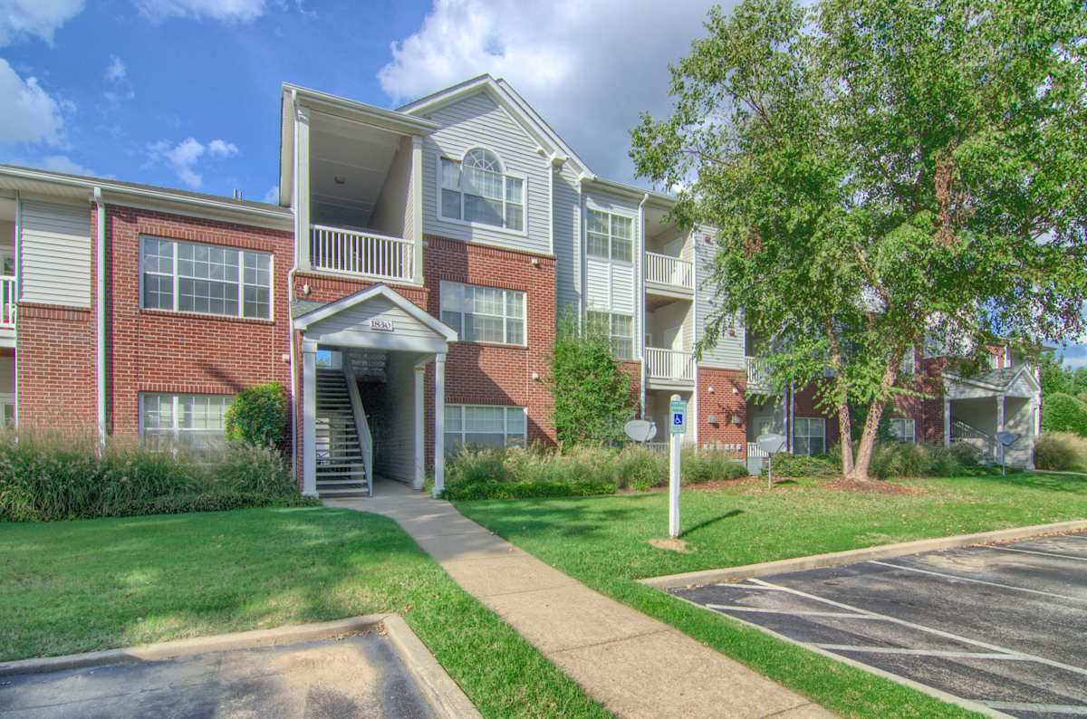Enclave at Wolfchase exterior with balconies and entrance stairs - Memphis, TN