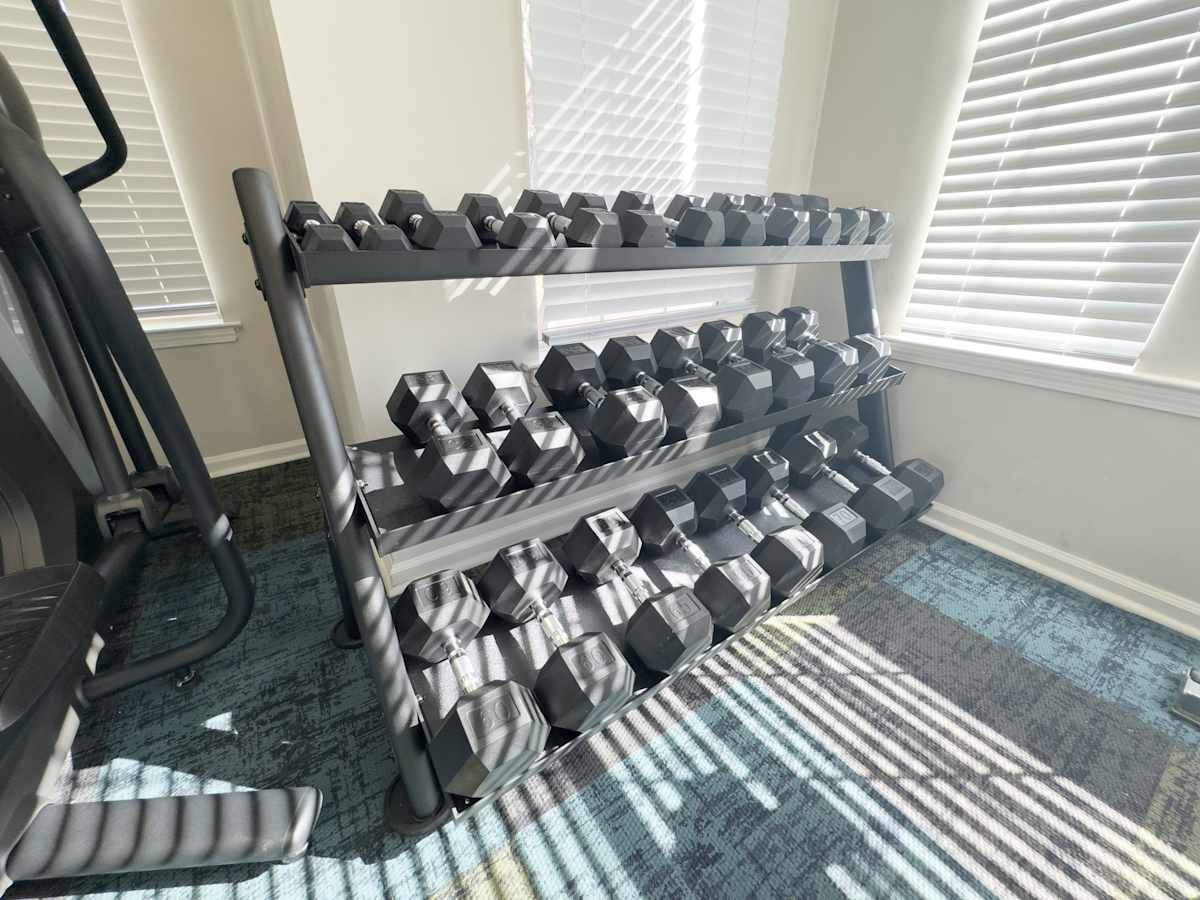 Enclave at Wolfchase fitness room with dumbbell rack - Memphis, TN