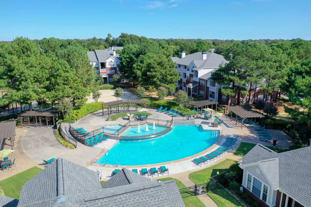 Enclave at Wolfchase pool with lounge chairs and pergolas - Memphis, TN