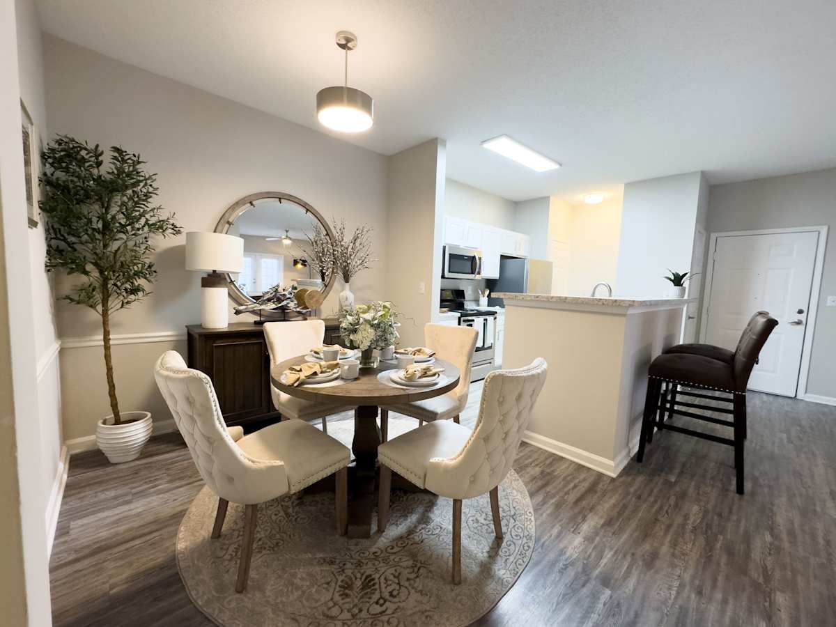 Model apartment: Enclave at Wolfchase living room with round table and chairs - Memphis, TN