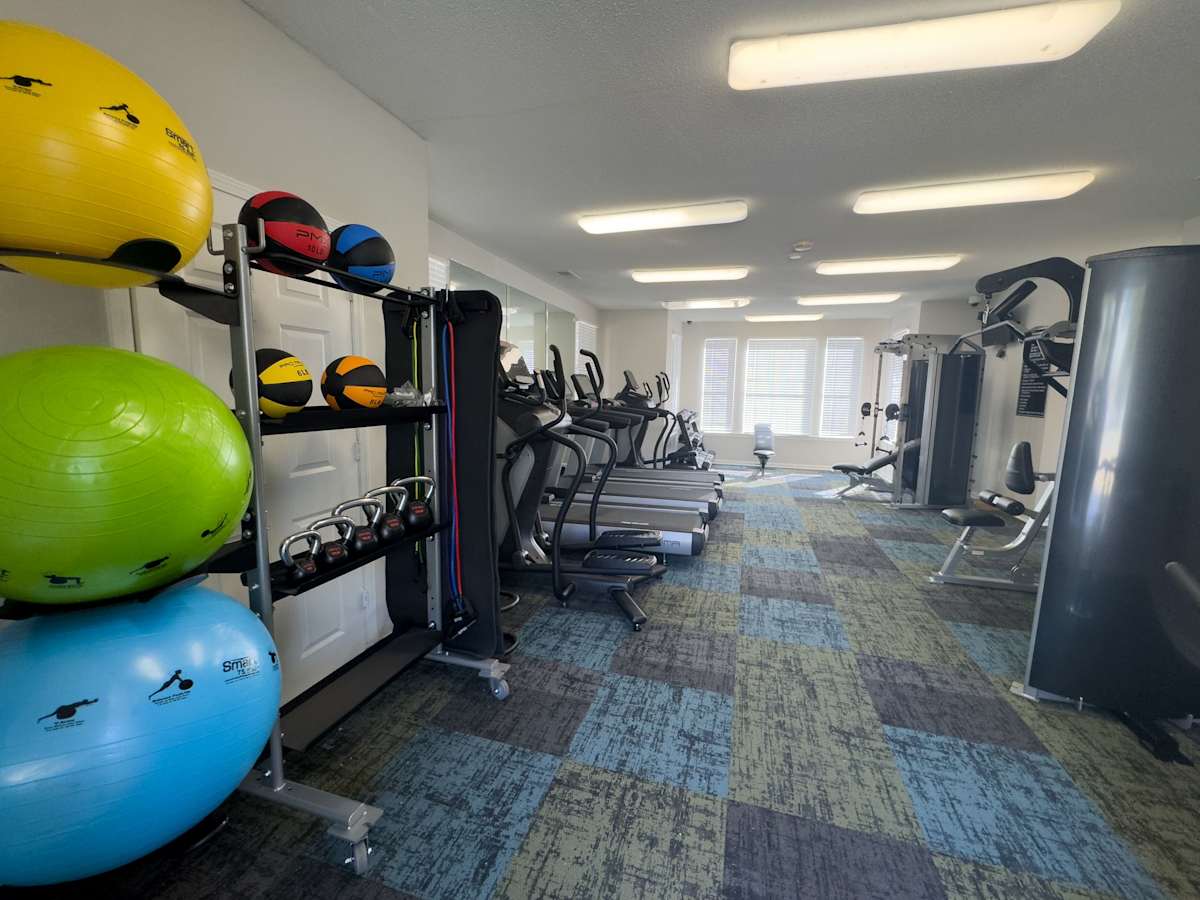 Enclave at Wolfchase fitness center with treadmills and exercise balls - Memphis, TN