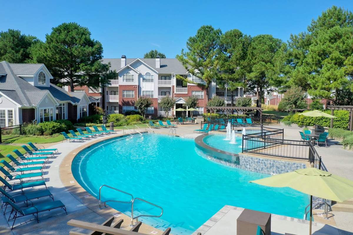Enclave at Wolfchase pool with lounge chairs and umbrellas - Memphis, TN